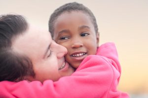 man hugging a child