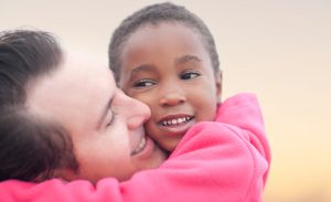 man hugging a child