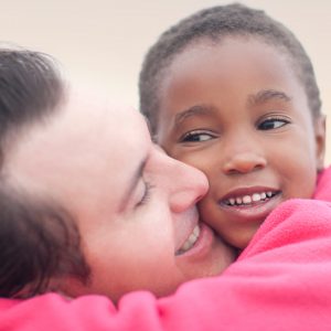 man hugging a child