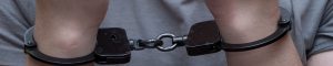 wrists of someone in handcuffs