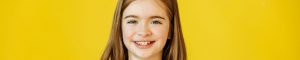 young girl smiling at camera
