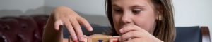 child playing with wooden blocks