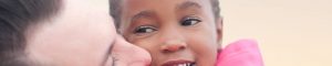 young child being hugged